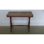 A Victorian mahogany stretcher table - Height 67cm x 90cm x 47cm - old repairs to leg