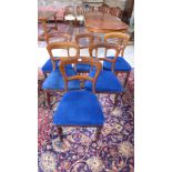 A set of six mahogany dining chairs with overstuffed seats on turned front legs