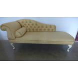 A modern Victorian style chaise lounge in buttoned yellow fabric - in good condition - Height 75cm