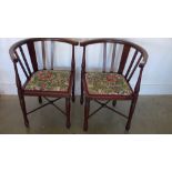 A pair of mahogany framed corner chairs with floral upholstered seats