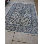 A hand knotted woolen fine Kashan rug - 2.90m x 2.