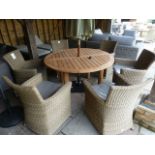 A Bramblecrest teak circular table with six armchairs,