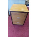 A wooden effect two drawer filing cabinet with lock and key - 53cm x 60.