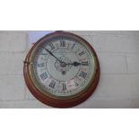 A German wall clock with a painted dial - Diameter 25cm - working in the saleroom