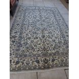 A hand knotted woolen fine Kashan rug - 3.03m x 2.