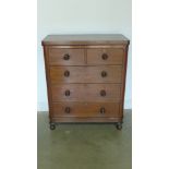 A Victorian chest of two short over three long drawers raised on turned supports - 94cm x 46cm x