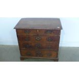 A Georgian walnut crossbanded chest of small proportions with two short over three long graduating