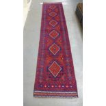 A hand knotted woolen Meshwani runner - 60cm x 246cm