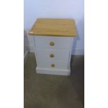 A new painted pine three drawer bedside in Skimming Stone Farrow and Ball