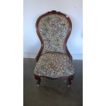 A good quality 19th century mahogany nursing chair recently re covered in a nice floral fabric