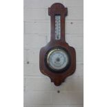 An inlaid mahogany aneroid barometer with thermometer retailed by Sidney Campkin and Sons Cambridge