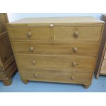 A Victorian stripped pine chest of 2 short over 3 long drawers on turned feet - Height 104cm x