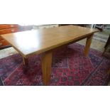 An oak extending dining table with a folding leaf - Height 79cm x 100cm x 180cm,