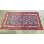 A handknotted woolen Baluchi rug - 1.82m x 1.