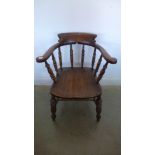 A 19th century ash and elm smokers bow armchair