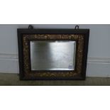 A brass and wooden mirror - 44cm x 37cm