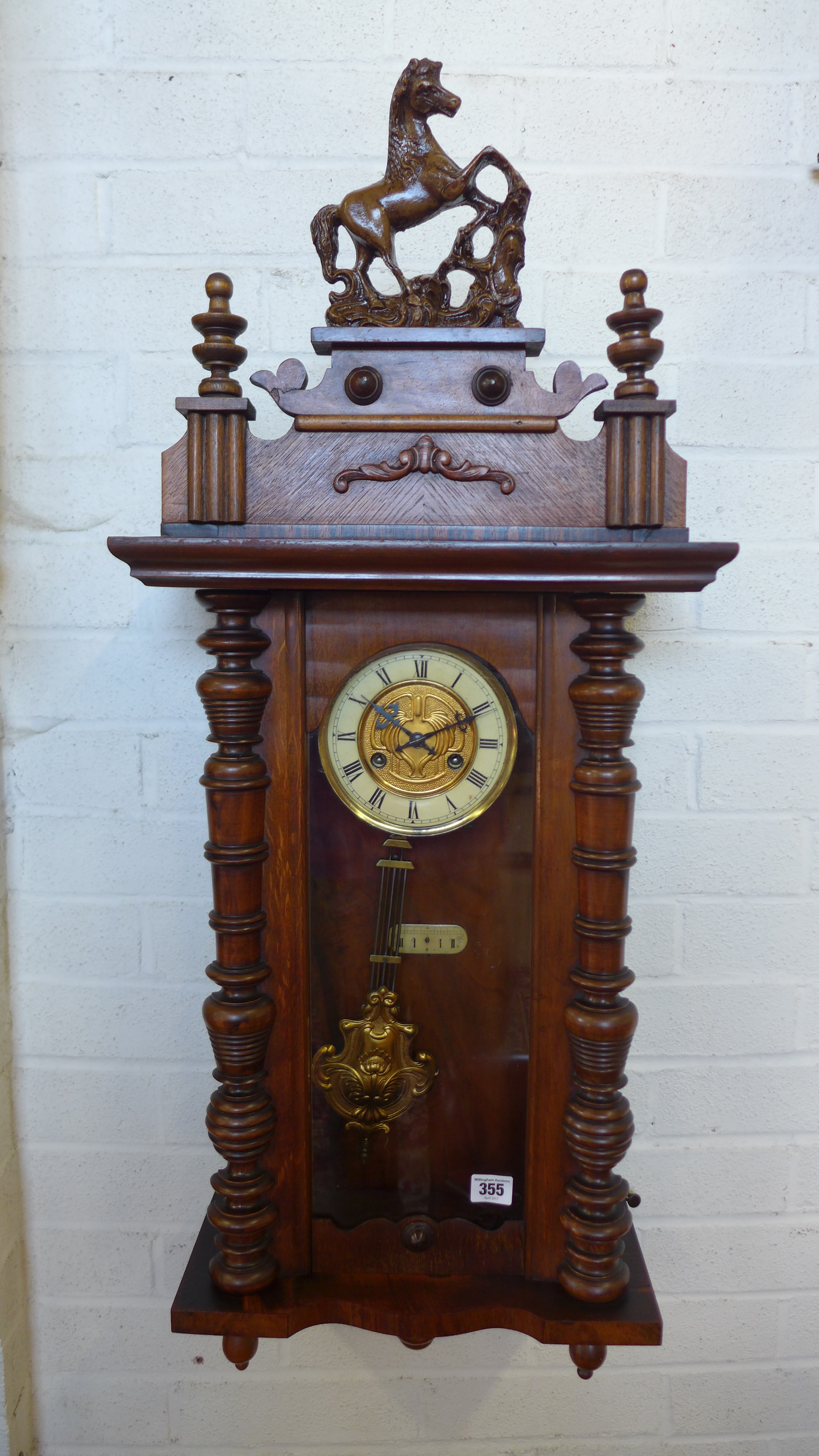 A spring driven walnut Vienna style wall clock - in working order - Height 97cm