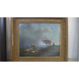 A gilt framed oil on canvas - animals grazing with figure to foreground,