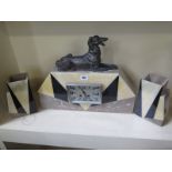 An Art Deco marble clock garniture with metal dog detail - Largest piece 47cm long