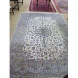 A hand knotted woolen Fine Kashan rug - 3.56m x 2.
