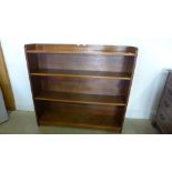 A circa 1930's light oak open bookcase with adjustable shelves - 107cm x 115cm x 23cm