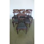 A set of six early 19th century mahogany dining chairs on turned front legs with repairs and damage