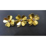 An Irish 18ct yellow gold and diamond triple four leaf clover brooch made by West and Son of Dublin