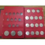 A collection of Queen Elizabeth II coins in special printed folder and red box