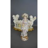 A Continental porcelain figure of a lady in floral design dress - some damage to lacework and a