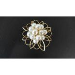 A 14ct yellow gold pendant brooch set with 12 cultured pearls - 6cm x 5cm - pearl size approx 7mm -