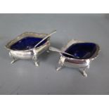 Two silver salts with spoons and blue glass liners - approx weight 2.