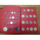 A collection of Queen Elizabeth II coins in special printed black folder