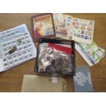 A collection of British and World coins and stamps in presentation packets in box