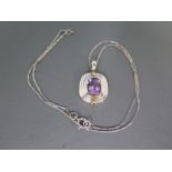 A 9ct white gold and amethyst pendant on a 9ct white gold chain - approx weight 6.