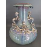 A Chinese vase decorated with five archaic dragons under a Jun style glaze - Height 28cm - small