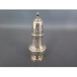A George III silver sugar caster with embossed foliate design - general usage