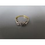 An 18ct white gold platinum and diamond ring - three diamonds to shoulder - ring size P - approx