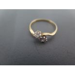An 18ct yellow gold and diamond crossover ring size N - approx weight 1.