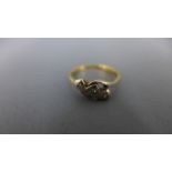 An 18ct yellow gold and three stone diamond ring - approx 2.