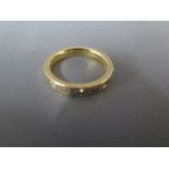 An 18ct yellow gold ring set with five square cut diamonds ring size Q/R - approx weight 8.