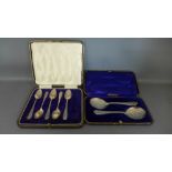 A pair of cased foliate engraved silver spoons hallmarked for Sheffield 1900/01 and a cased set of