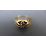 A presumed 18ct yellow gold ring with single diamond to shoulder, size of diamond approx 0.