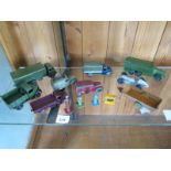 Thirteen various types of vintage Dinky toys including small rare petrol pumps and oil dispenser