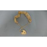 A 9ct rose gold bracelet with heart shaped clasp - approx weight 22.