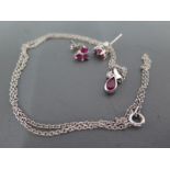 An 18ct white gold diamond and ruby pendant and earrings - clean and bright
