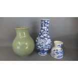 A celadon vase of ovoid form - Height 17cm x Diameter 13cm - and two Oriental blue and white vases