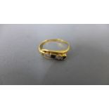 An 18ct yellow gold diamond and sapphire ring - approx weight 2 grams - ring size L - heavy usage