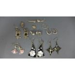 A selection of costume jewellery in the form of earrings,
