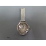 A platinum cased ladies wristwatch, the white dial with Arabic numerals,