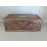 A carved oak offertory box, hinged lid with coin slot - 36.